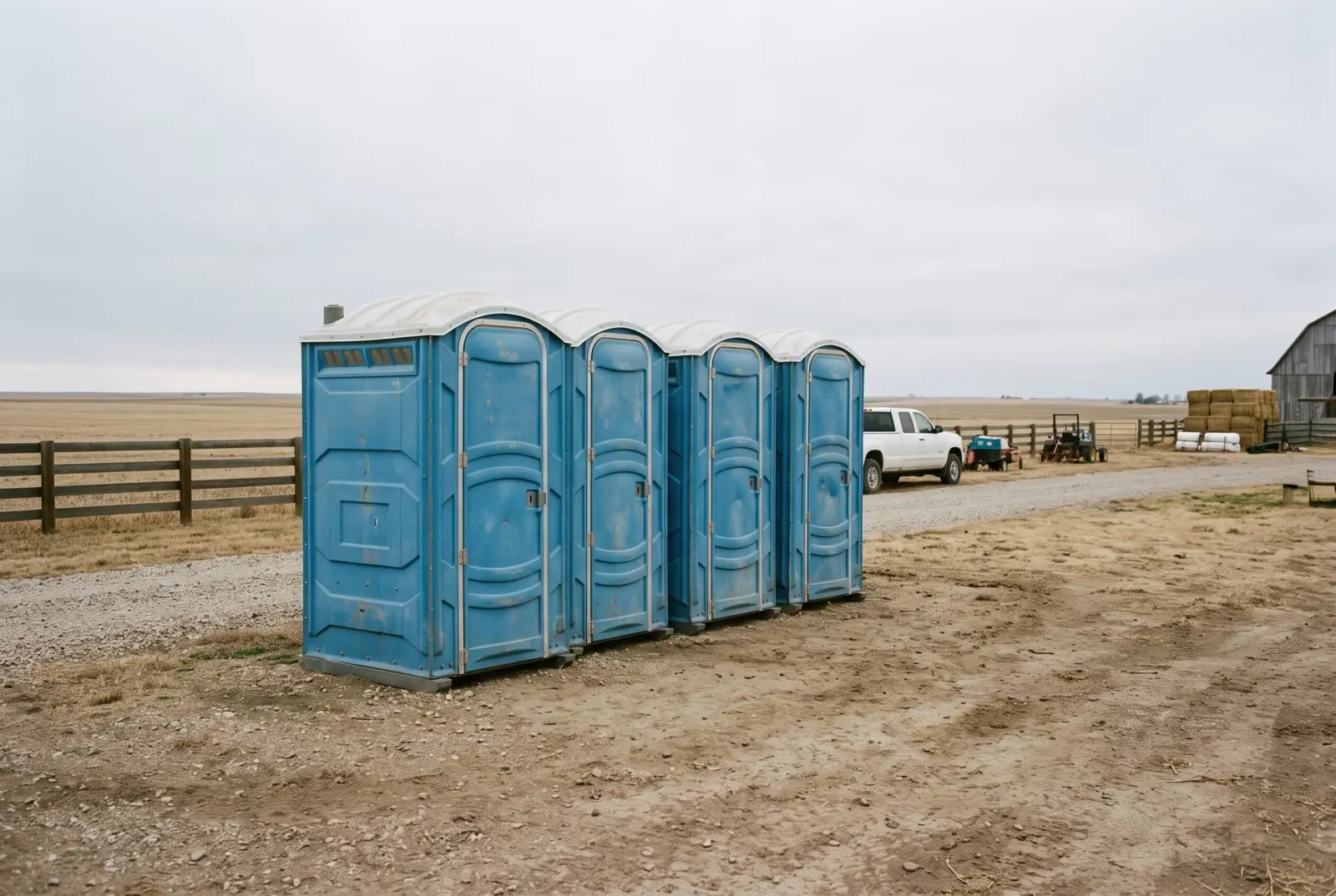 Row of portable toilets at a long-term rural work site